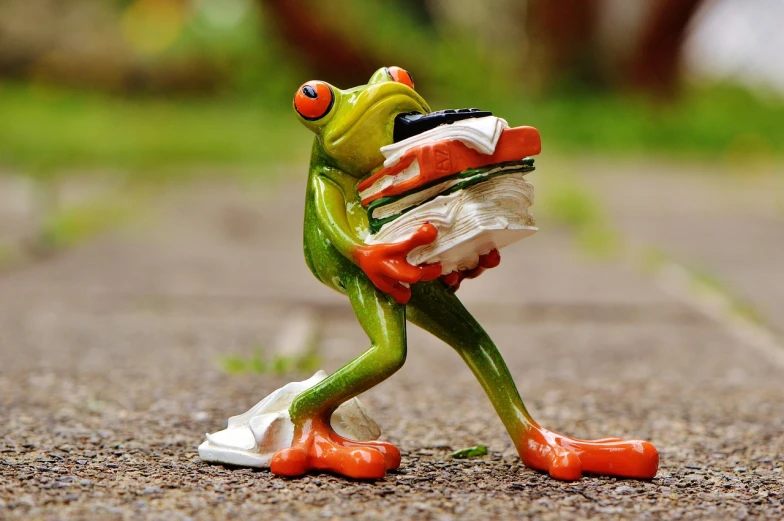 a figurine of a frog carrying a sandwich, a picture, pexels, figuration libre, holding books, moderately detailed, walking, peter henket