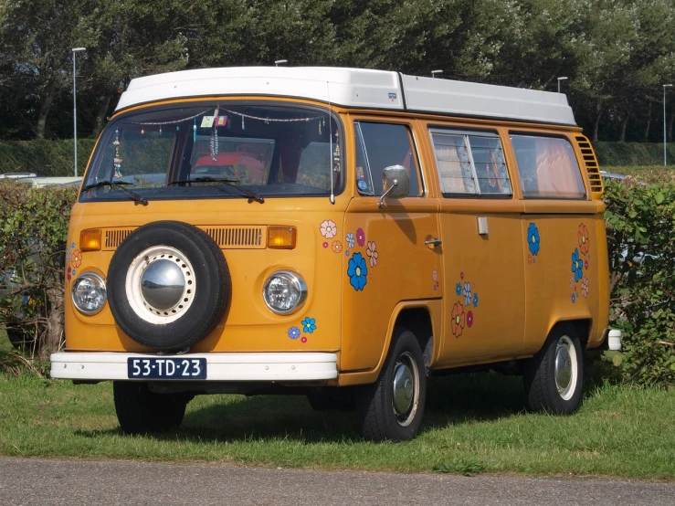 a yellow van parked on the side of the road, hippie motifs, hd —h 1024, normandy, bumblebee
