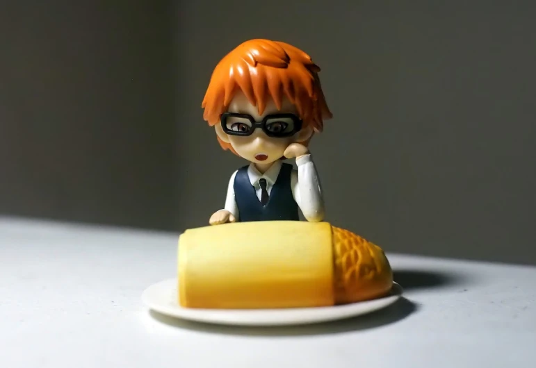 a close up of a figurine of a person on a plate, a picture, inspired by Yumihiko Amano, tumblr, shin hanga, orange - haired anime boy, corn, !!posing_as_last_supper, wearing a suit and glasses