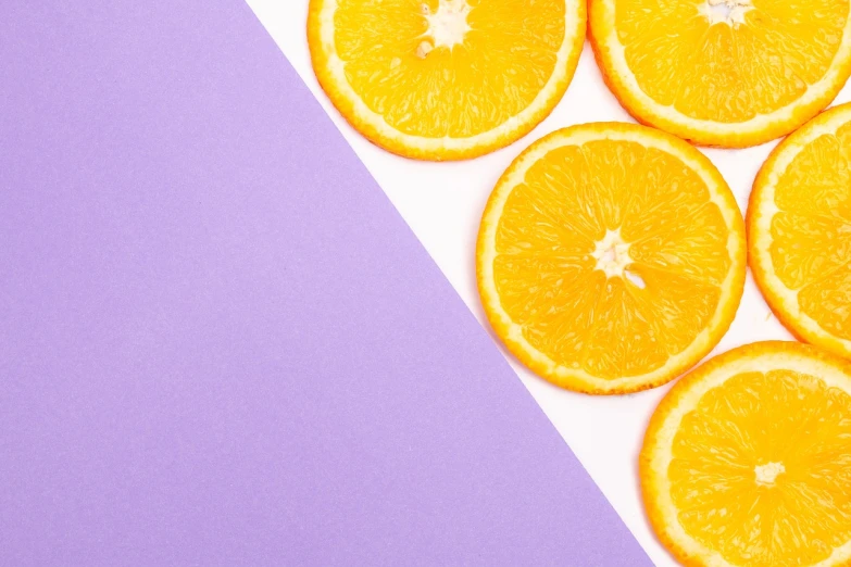 a group of orange slices sitting on top of a purple and white surface, a minimalist painting, trending on unsplash, postminimalism, 🦩🪐🐞👩🏻🦳, half image, background image, paper cutouts of plain colors