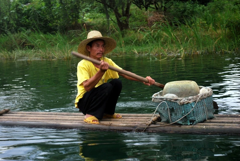 a man that is sitting on a raft in the water, inspired by Lu Zhi, flickr, farmer, tourist photo, very very very very beautiful, fish man