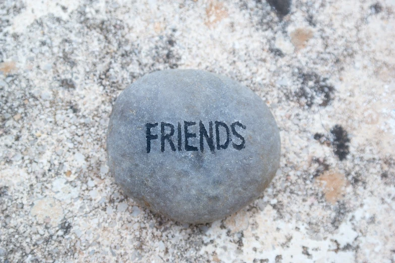 a stone with the word friends written on it, a photo, inspired by Rudolf Freund, flickr, 🎨🖌, elliot alderson, 2009, very accurate photo
