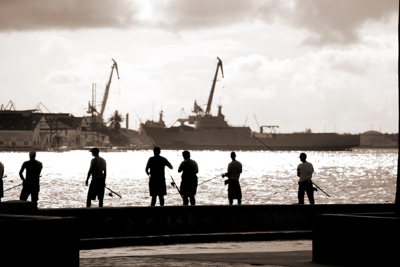 a group of people standing next to a body of water, by Fernando Gerassi, flickr, figuration libre, the harpoon is sharp, outlined silhouettes, manila, harbour