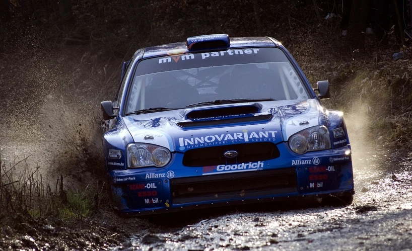 a rally car driving on a dirt road, a photo, by Dietmar Damerau, flickr, photorealism, taken in the 2000s, subaru, confetti, innocent look