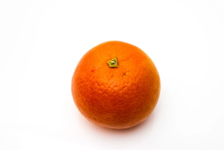 an orange sitting on top of a white surface, a stock photo, highly detailed product photo, portlet photo