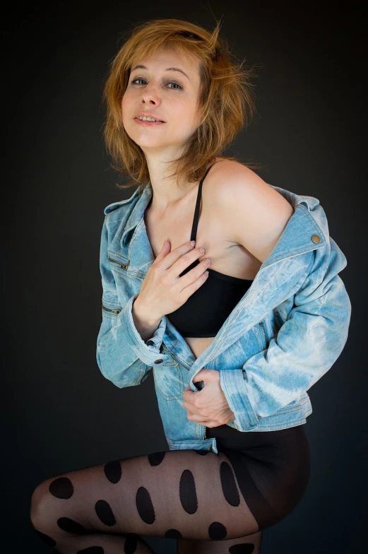 a woman in tights and a denim jacket, a portrait, inspired by Jean-Jacques Henner, flickr, figuration libre, open v chest clothes, sigma 85/1.2 portrait, model with attractive body, realistic studio portrait