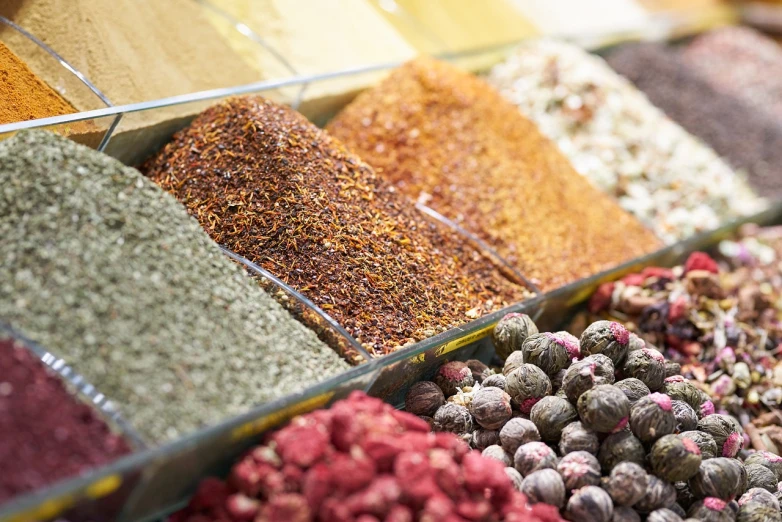 a display case filled with lots of different types of spices, a picture, renaissance, close-up product photo, mixture turkish and russian, stacked image, bottom angle