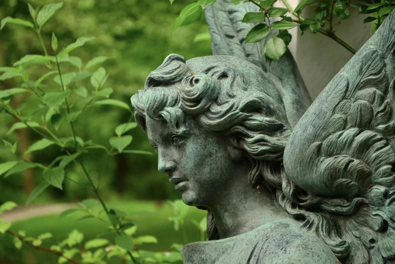 a close up of a statue of an angel, inspired by Edward Robert Hughes, trending on pixabay, in a verdant garden, dark shading, close - up profile face, metal wings