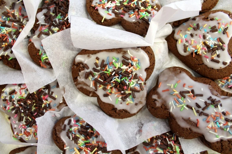 a pile of cookies with frosting and sprinkles, by Leonard Bahr, tumblr, some chocolate sauce, heart, fitness, glazed