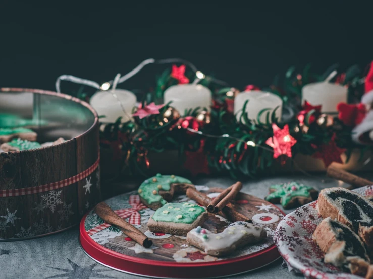 a close up of a plate of food on a table, a pastel, folk art, christmas night, cookies, green and red tones, nostalgic vibes