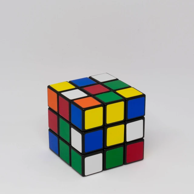 a rubik cube sitting on top of a white surface, a jigsaw puzzle, cubo-futurism, product introduction photo