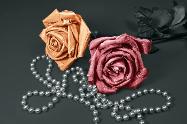 a rose and a pearl necklace on a table, a colorized photo, art photography, made with zbrush, dark grey and orange colours, it was the worst of times, many sakura origami roses