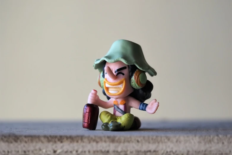 a small figurine sitting on top of a table, unsplash, tank girl, clash royal style characters, gorgeous jungle ranger, squinting