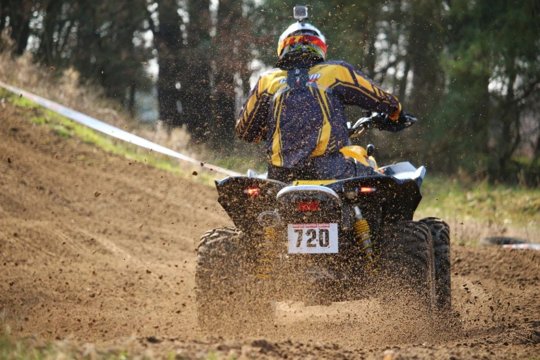 a man riding on the back of a dirt bike, a picture, flickr, figuration libre, all terrain vehicle race, ultra 4k, at racer track, warts