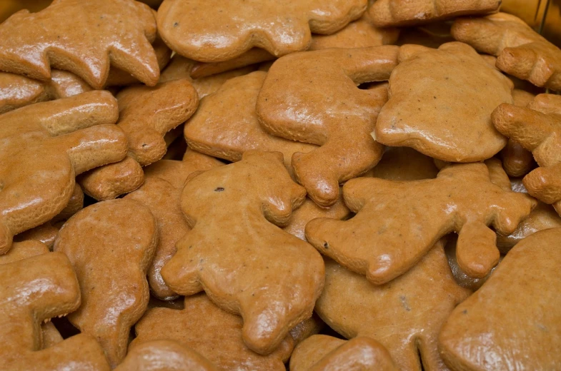 a pile of cookies sitting on top of each other, a picture, folk art, detailed zoom photo, animal shapes, high res photo, ocher