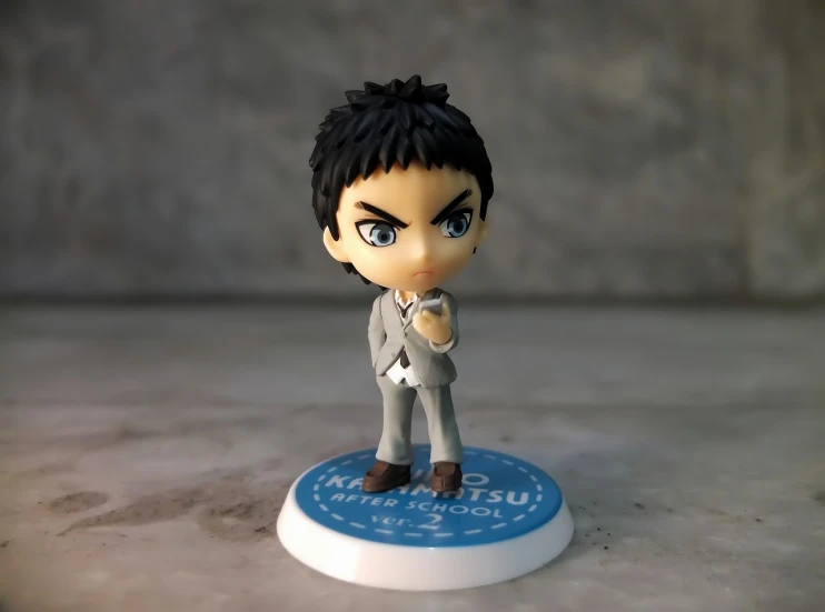 a close up of a figurine of a person, inspired by Un'ichi Hiratsuka, shin hanga, anime chibi, in a strict suit, from yowamushi pedal, tom cruise as kenshiro
