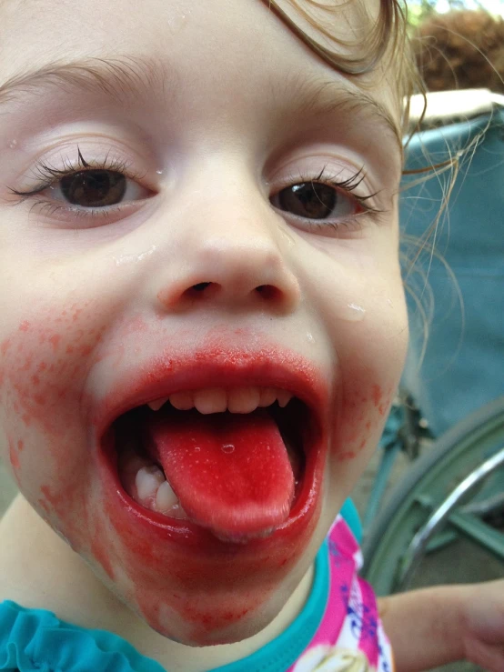 a little girl with blood all over her face, a picture, by Samuel Scott, licking tongue, raspberry, ash ketchup, medium closeup