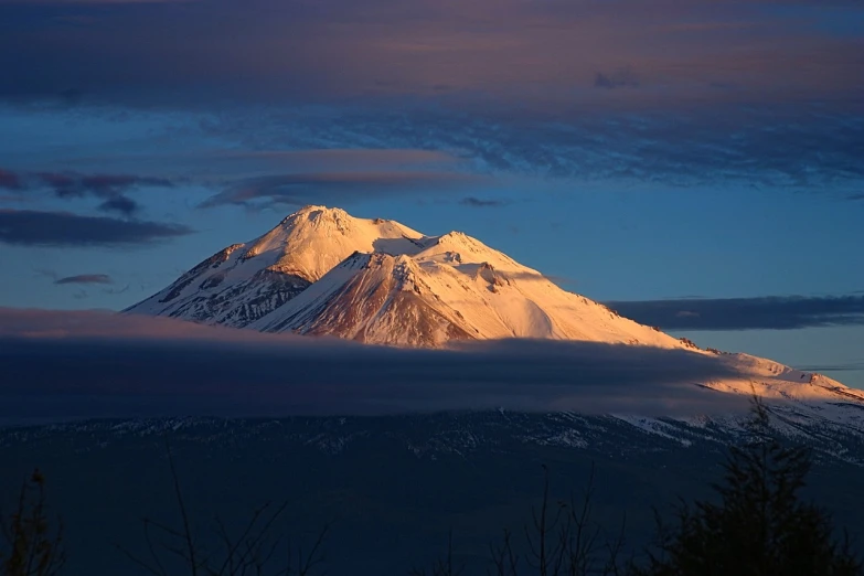 a mountain covered in snow under a cloudy sky, a picture, by Andrei Kolkoutine, flickr, romanticism, at snowy fuji mountain sunrise, central california, mount doom, 6 0 0 mm