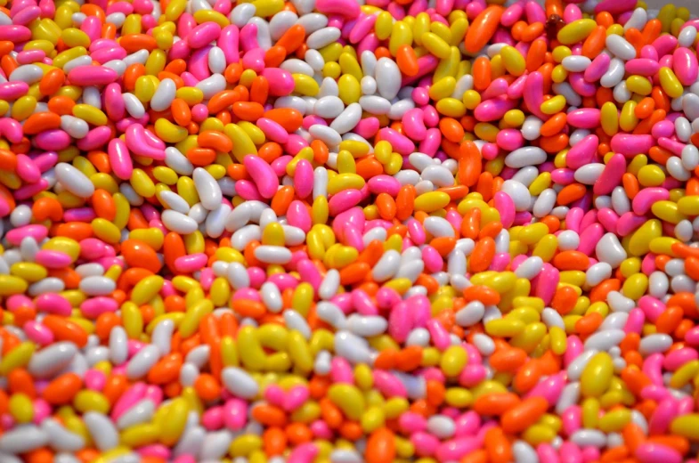 a bowl filled with lots of colorful sprinkles, inspired by Yayou Kusama, pexels, overflowing with baked beans, pink and yellow, full of colour 8-w 1024, closeup