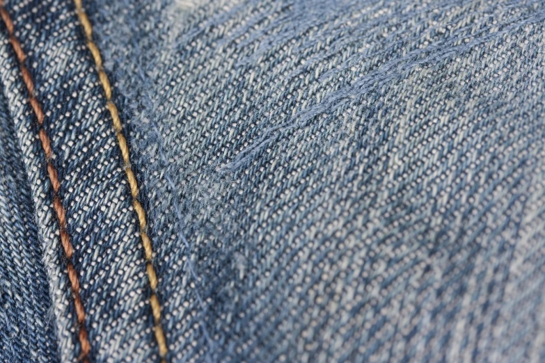 a close up of a pair of blue jeans, a macro photograph, renaissance, stitches, warm sunshine, 7 0 mm photo, high details photo