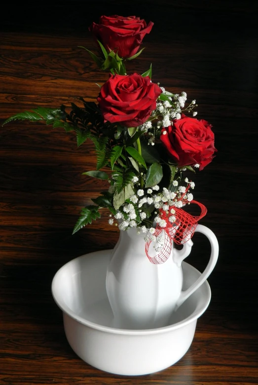 a white vase filled with red roses and baby's breath, by Valentine Hugo, pexels, romanticism, flowers!!!!, tea, graceful curves, sandra chevier