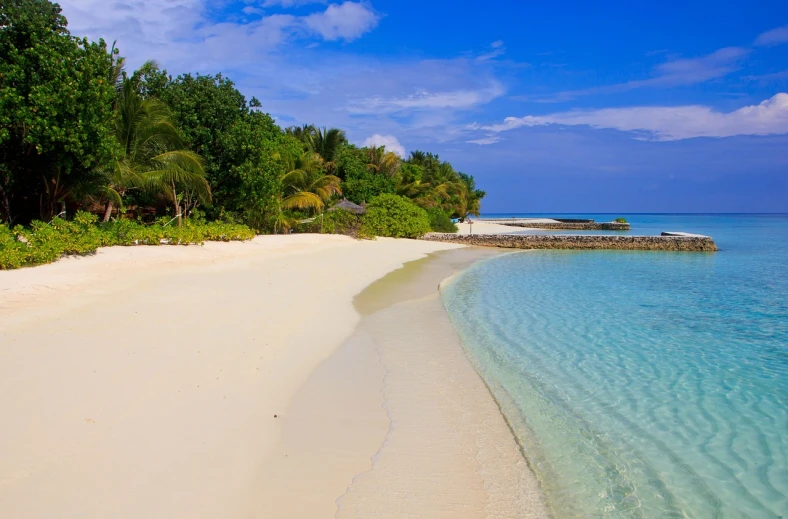 a sandy beach next to a body of water, a picture, white beaches, tropical style, crystal waters, sand banks