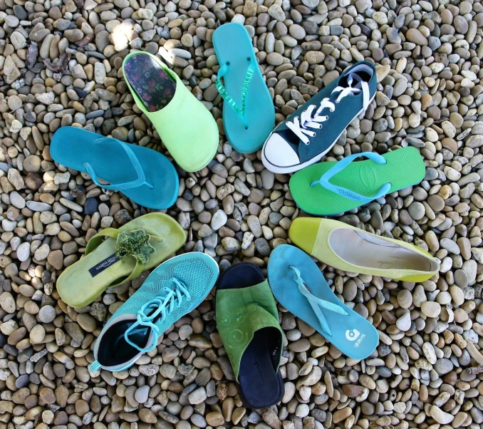 several pairs of shoes are arranged in a circle, inspired by Jan Rustem, flickr, green and blue color scheme, having fun in the sun, peyote colors, seaglass