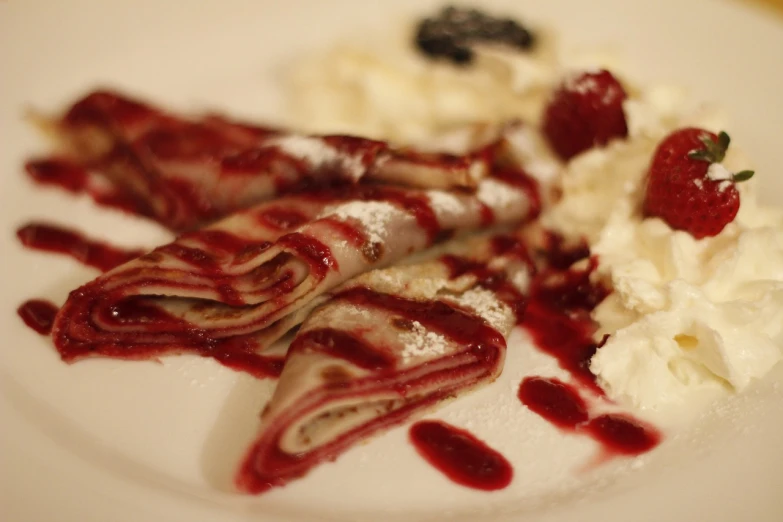 a white plate topped with crepes and whipped cream, by Aleksander Gierymski, flickr, renaissance, blood, cutest, stained”