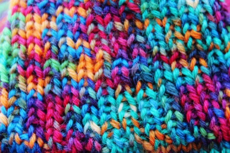 a close up of a multicolored knitted hat, inspired by Myles Birket Foster, flickr, colorful”, full res, silk colors, very vibrant