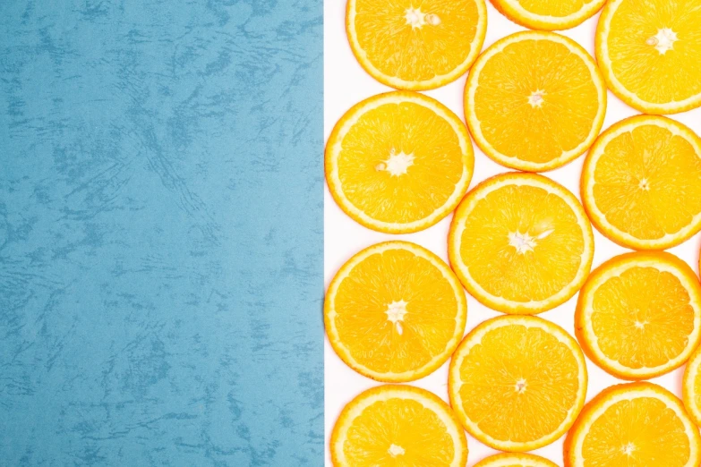 a group of orange slices sitting next to each other, a stock photo, minimalism, background yellow and blue, white border and background, miniature product photo