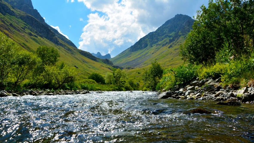 a river running through a lush green valley, a picture, shutterstock, hurufiyya, uk, craggy mountains, underwater glittering river, - - ar 9 : 1 6