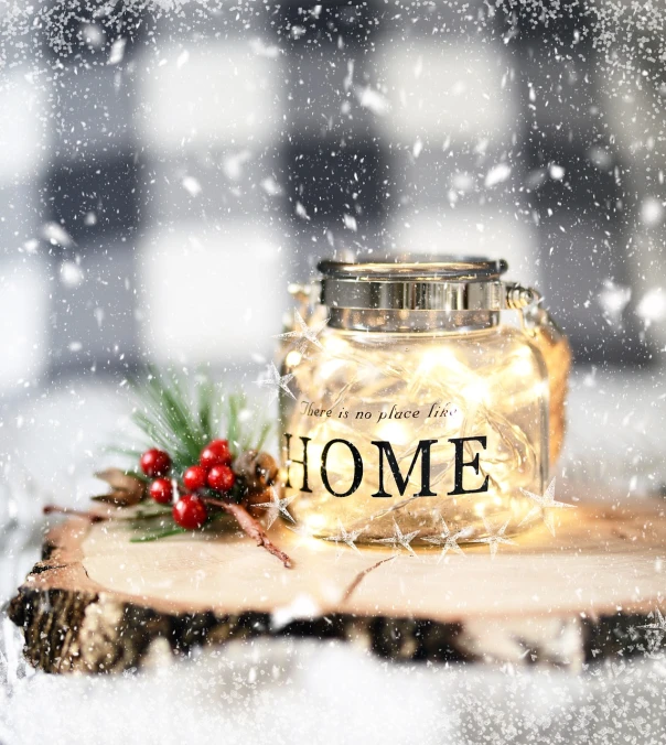 a candle that is sitting on a piece of wood, a picture, snow falling, home display, in white lettering, high res photo