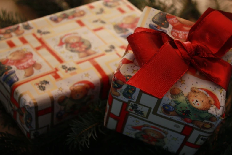 a christmas present sitting on top of a christmas tree, a picture, by Maksimilijan Vanka, pexels, realism, birthday wrapped presents, closeup - view, two, from 2001