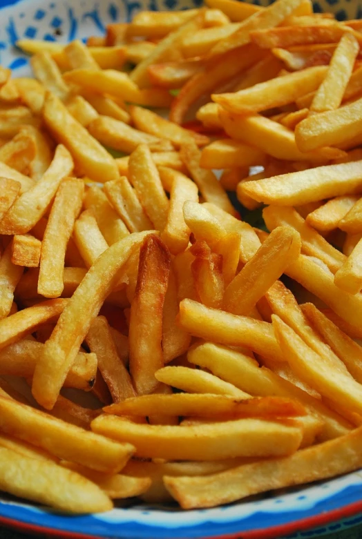 a plate of french fries on a table, a screenshot, figuration libre, chaos, close-up!!!!!!, wallpaper - 1 0 2 4, stripes