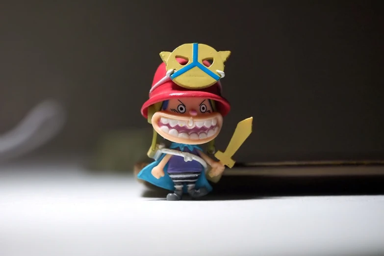 a close up of a toy on a table, inspired by Eiichiro Oda, tumblr, sōsaku hanga, wario, 40 mm, 1 figure only, very low quality