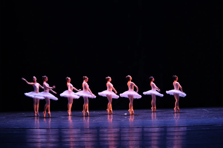 a group of ballerinas standing on a stage, a picture, by Verónica Ruiz de Velasco, flickr, arabesque, kimitake yoshioka, concert, sao paulo, half - turn