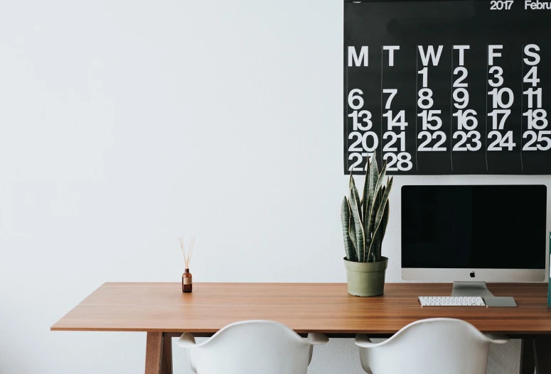 a desktop computer sitting on top of a wooden desk, by Karl Buesgen, unsplash, minimalism, countdown, with cactus plants in the room, dining table, whiteboards