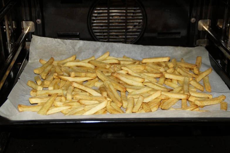 a tray of french fries in an oven, inspired by Pia Fries, figuration libre, unedited, hasselblatt, jackstraws, work in progress