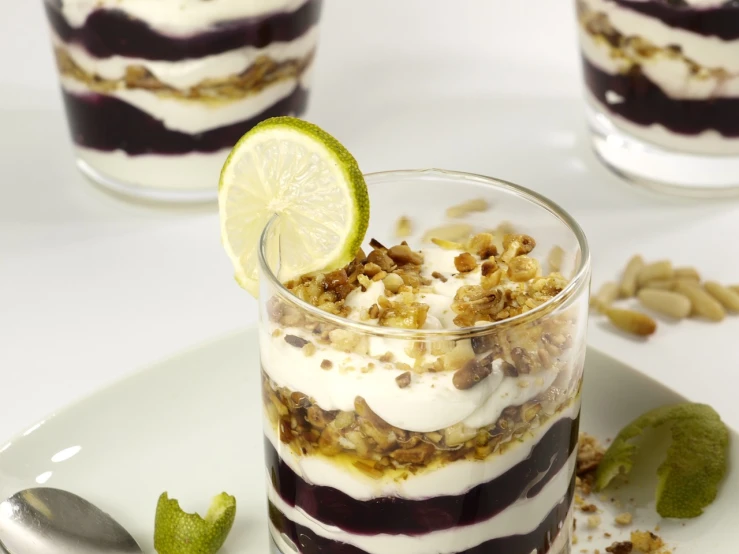 a dessert sitting on top of a white plate, inspired by Antonio Rotta, multi - layer, blueberry, crisp and clear, jars