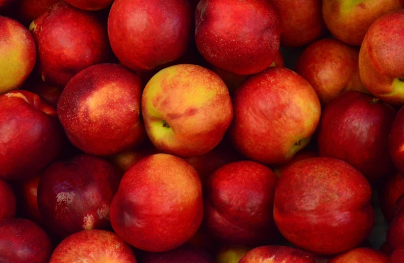 a pile of red apples sitting on top of each other, by Jan Rustem, bottom angle, peaches, detailed zoom photo, close-up product photo