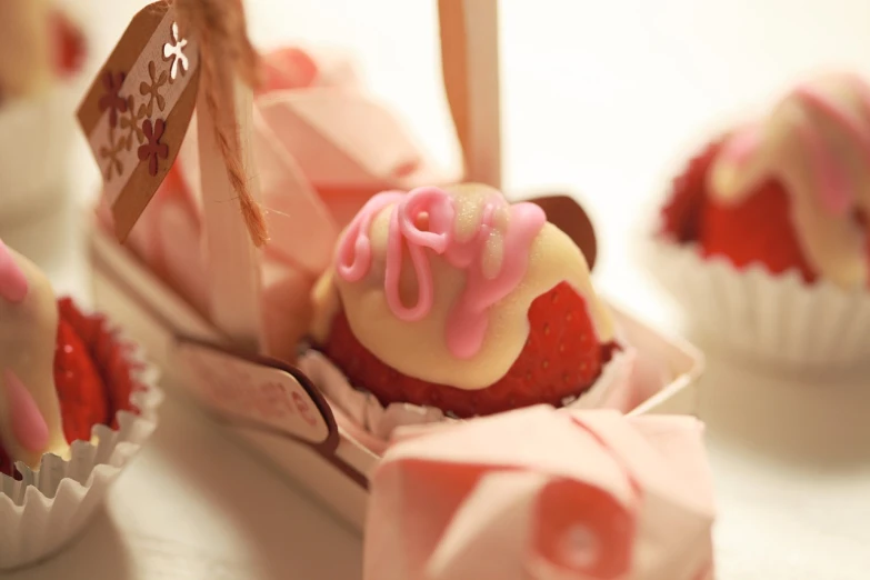 a group of cupcakes sitting on top of a table, a picture, by Ayami Kojima, tumblr, romanticism, strawberry, closeup - view, more details, detailed picture