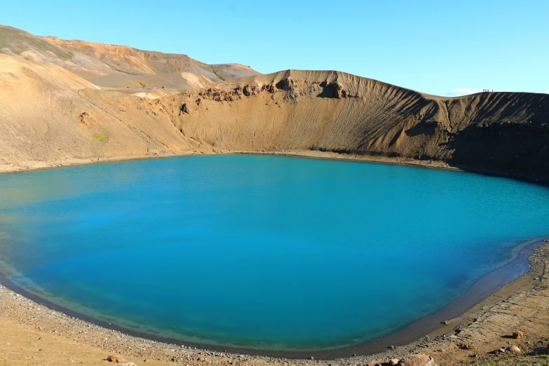 a blue lake with a mountain in the background, a photo, by Hallsteinn Sigurðsson, hurufiyya, terraforming jezero crater, light blue water, tar pit, round-cropped