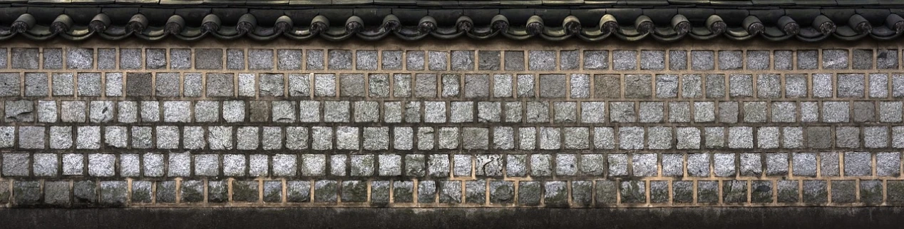 a black and white photo of a brick wall, a mosaic, inspired by Sesshū Tōyō, unsplash, shin hanga, korean traditional palace, color photo, stone and glass and gold, kaguya ōtsutsuki