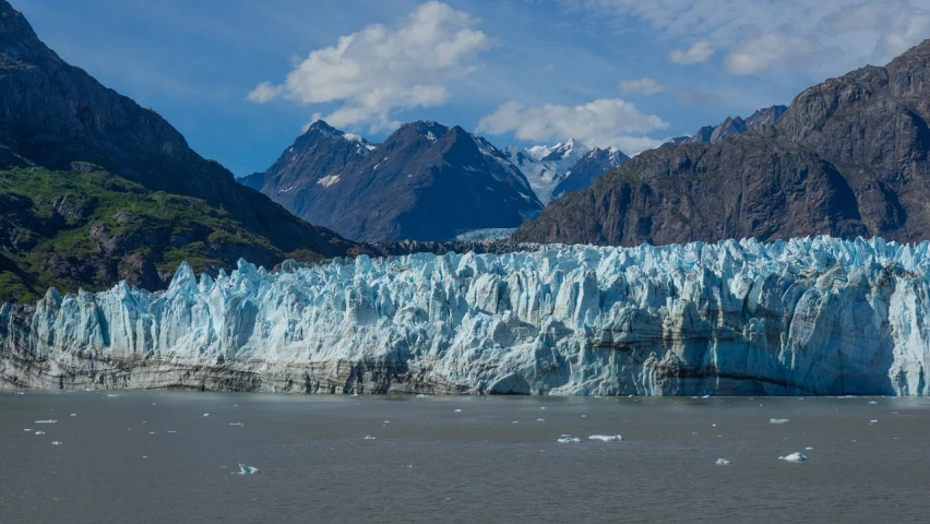 a large glacier in the middle of a body of water, a picture, by George Claessen, pexels, plein air, warm shades of blue, polarizer, twin peaks, electric cats that fly over ice