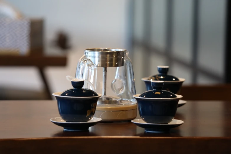 a couple of cups sitting on top of a table, by An Zhengwen, flickr, afp, steam, product display, balanced masterpiece