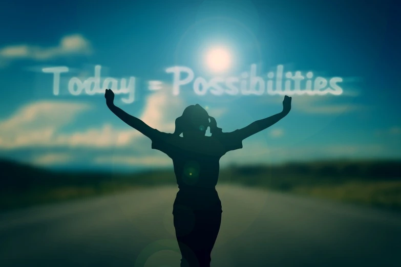 a woman standing on a road with her arms in the air, a picture, by Kurt Roesch, pixabay, happening, with text, infinite possibilities, today\'s featured photograph 4k, stylized silhouette