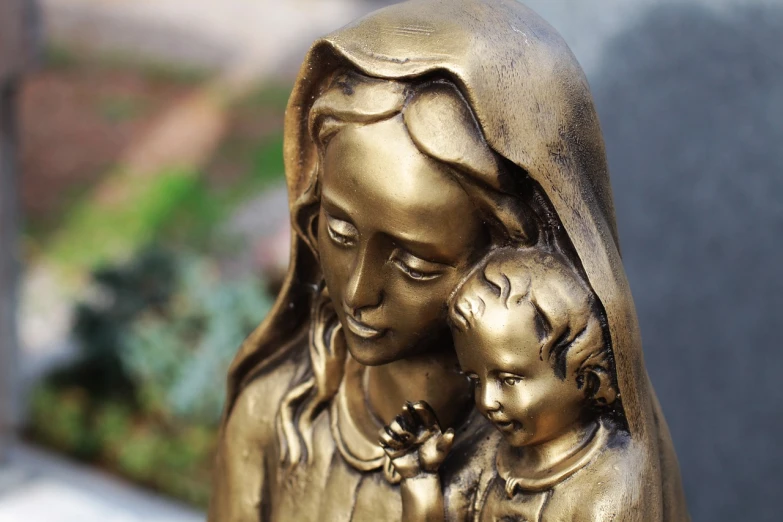 a statue of a woman holding a child, a statue, fine art, closeup photo, roman catholic icon, made in bronze, mid shot photo