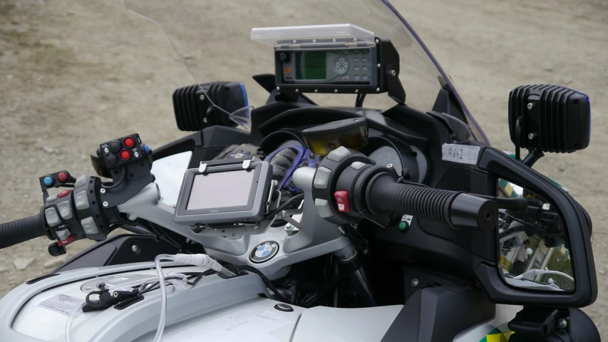 a close up of the handlebars of a motorcycle, les automatistes, navigation command center, bmw, with pipes attached to it, lab