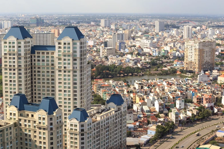 a view of a city from the top of a building, by Sam Dillemans, shutterstock, phuoc quan, low detail, 2 0 2 2 photo, in 2 0 1 5