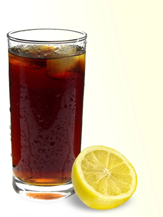 a glass of soda next to a half of a lemon, a digital rendering, istockphoto, tea, brown water, striking pose